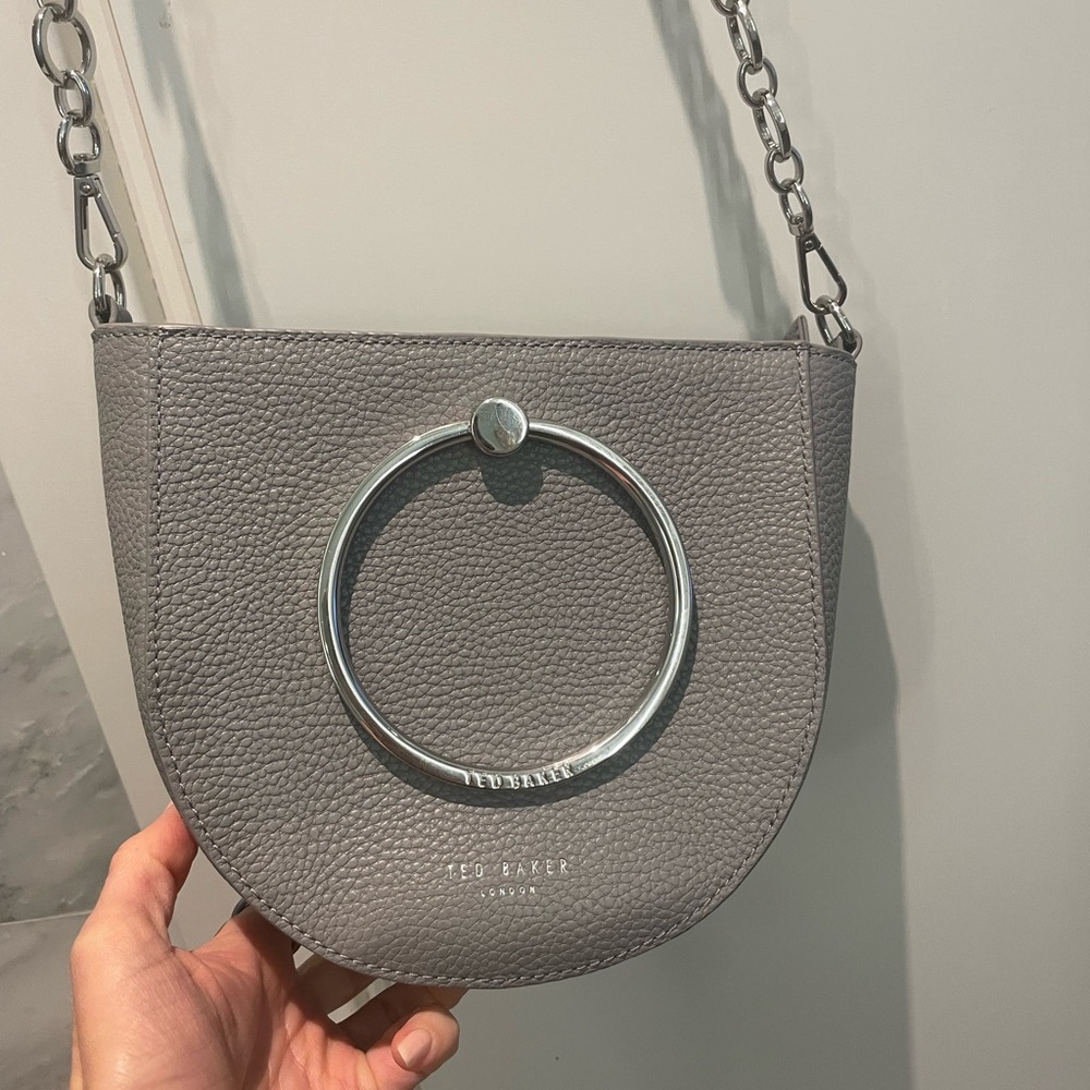 TED BAKER
Grey Fiorel Ring Handle Curved Crossbody Bag